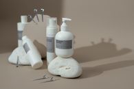 White Plastic Bottle on White Table