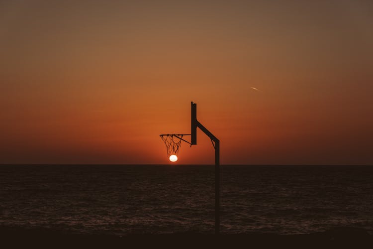 Basketball Backboard Against Picturesque Sundown