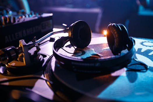 Dynamic close-up of DJ equipment with headphones on a turntable, capturing the nightlife ambiance.
