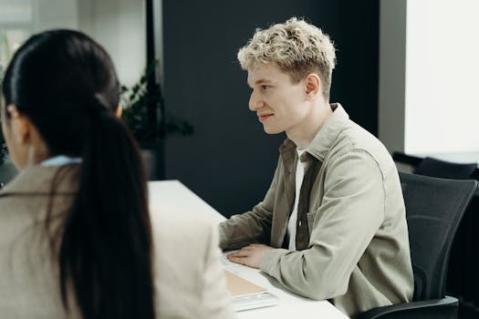 Focused business professionals engaged in a collaborative office meeting.