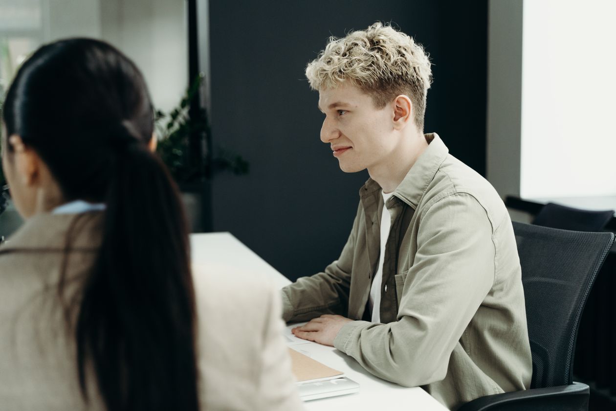 Colleagues talking in a modern office meeting