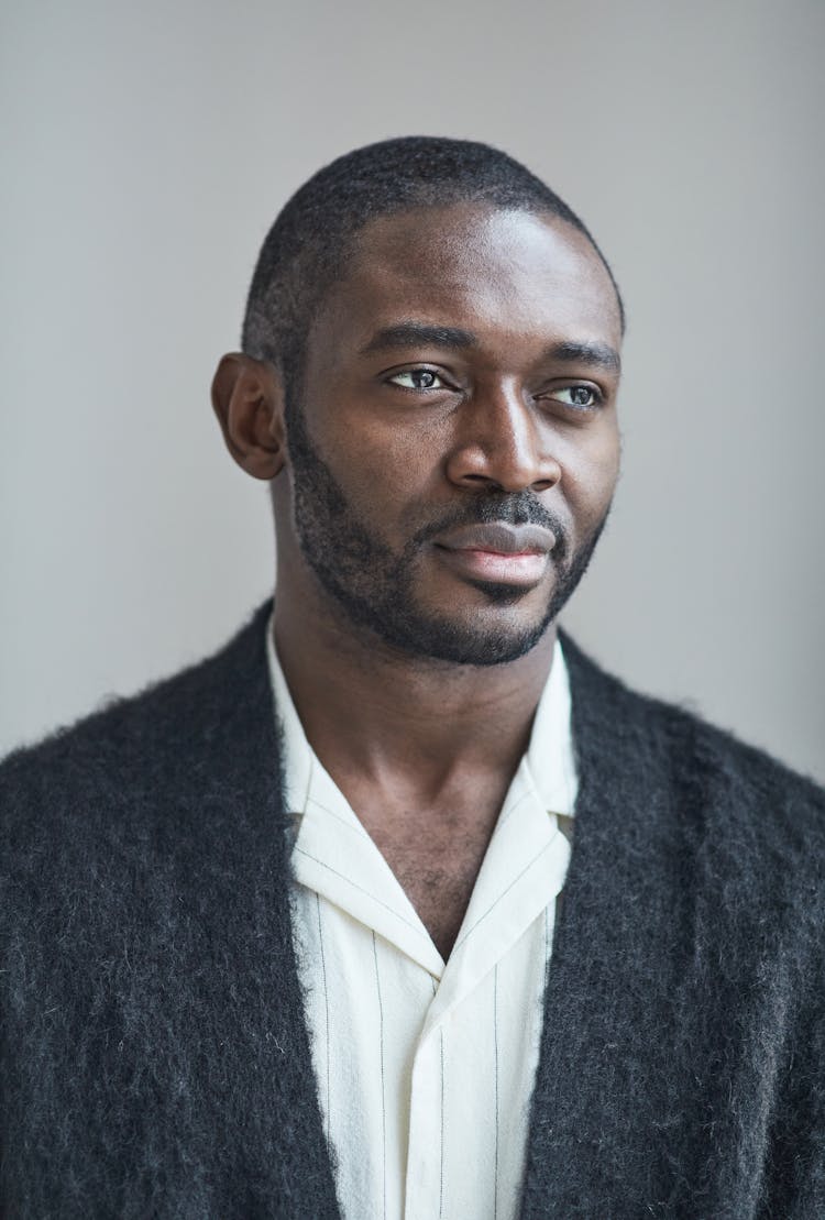 A Bearded Man In Gray Cardigan