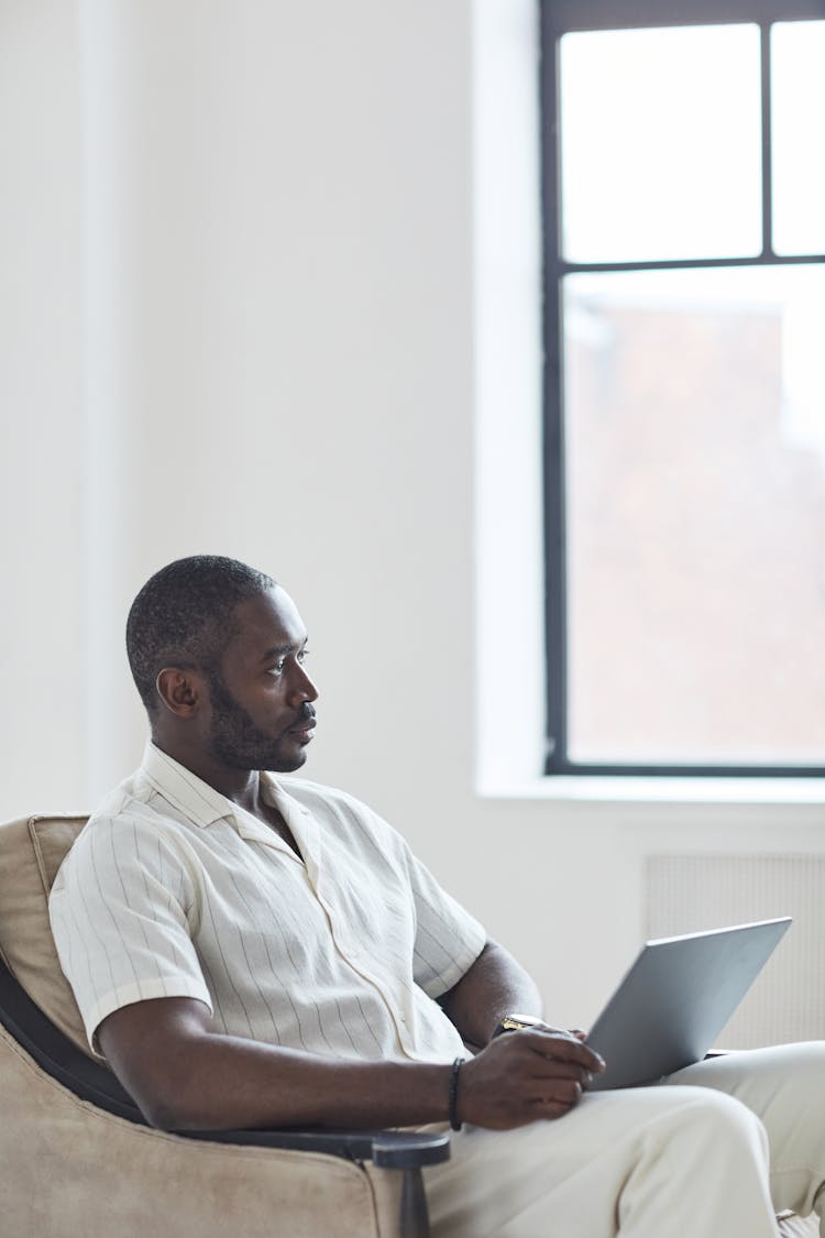 A Businessman Working At Home