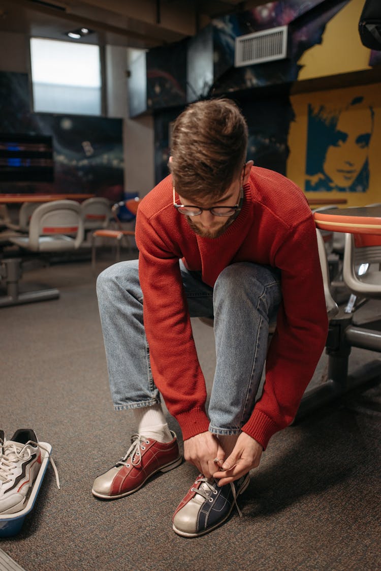 A Man Tying His Bowling Shoe