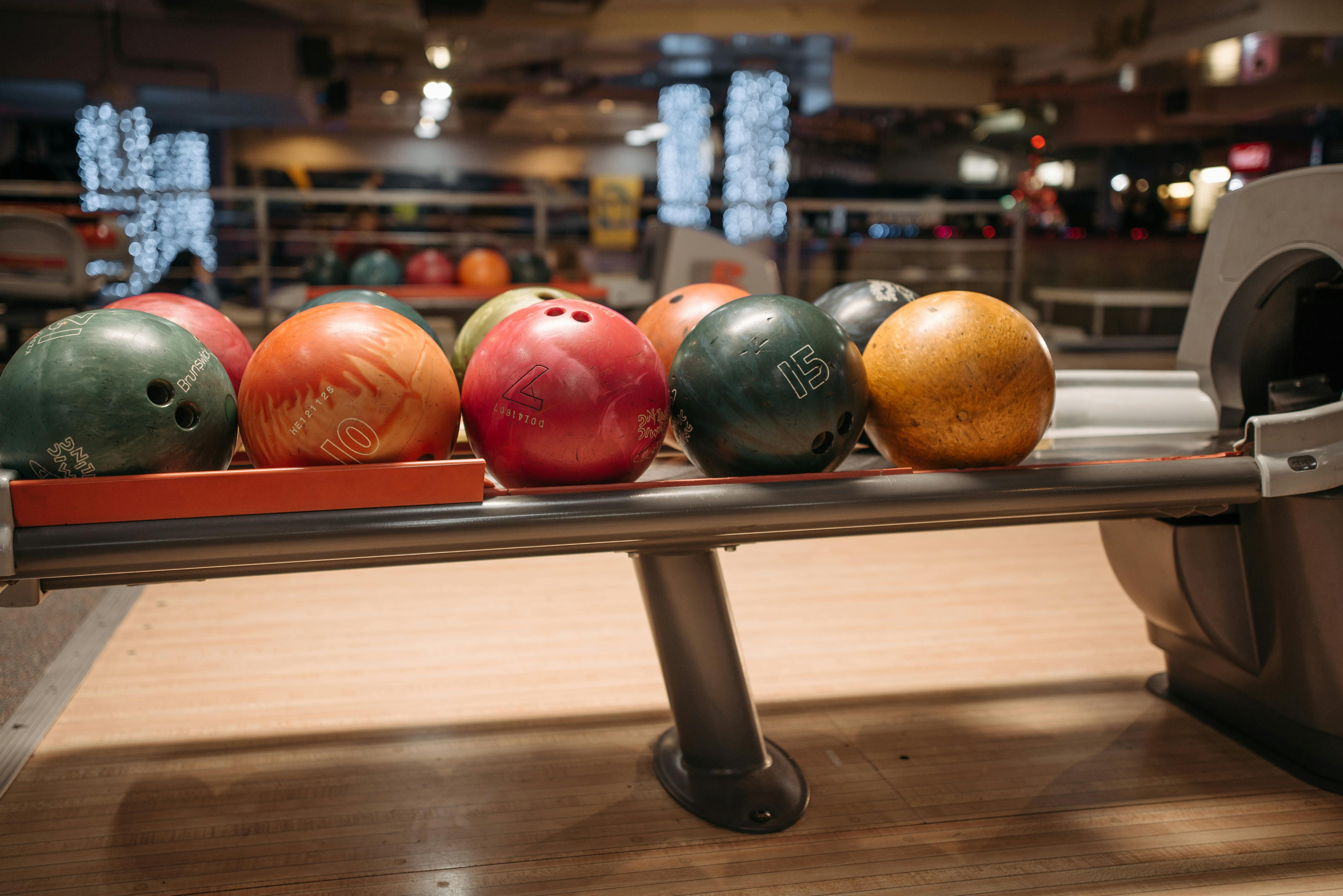 Colorful Bowling Balls on a Return System · Free Stock Photo
