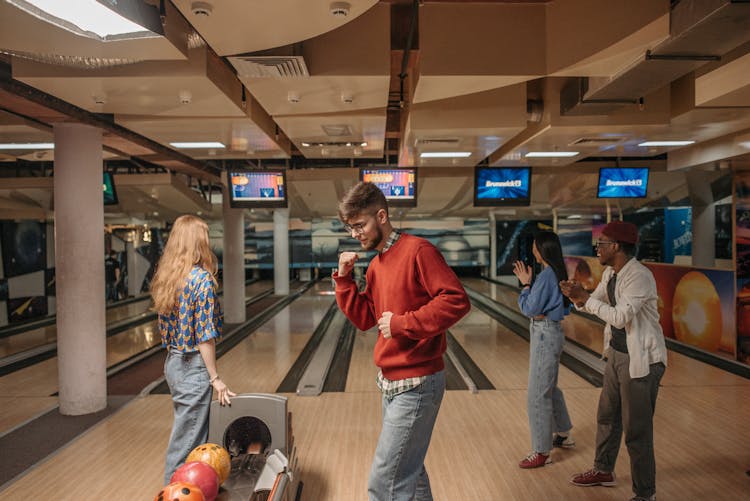 Group Of Happy Friends Bowling 