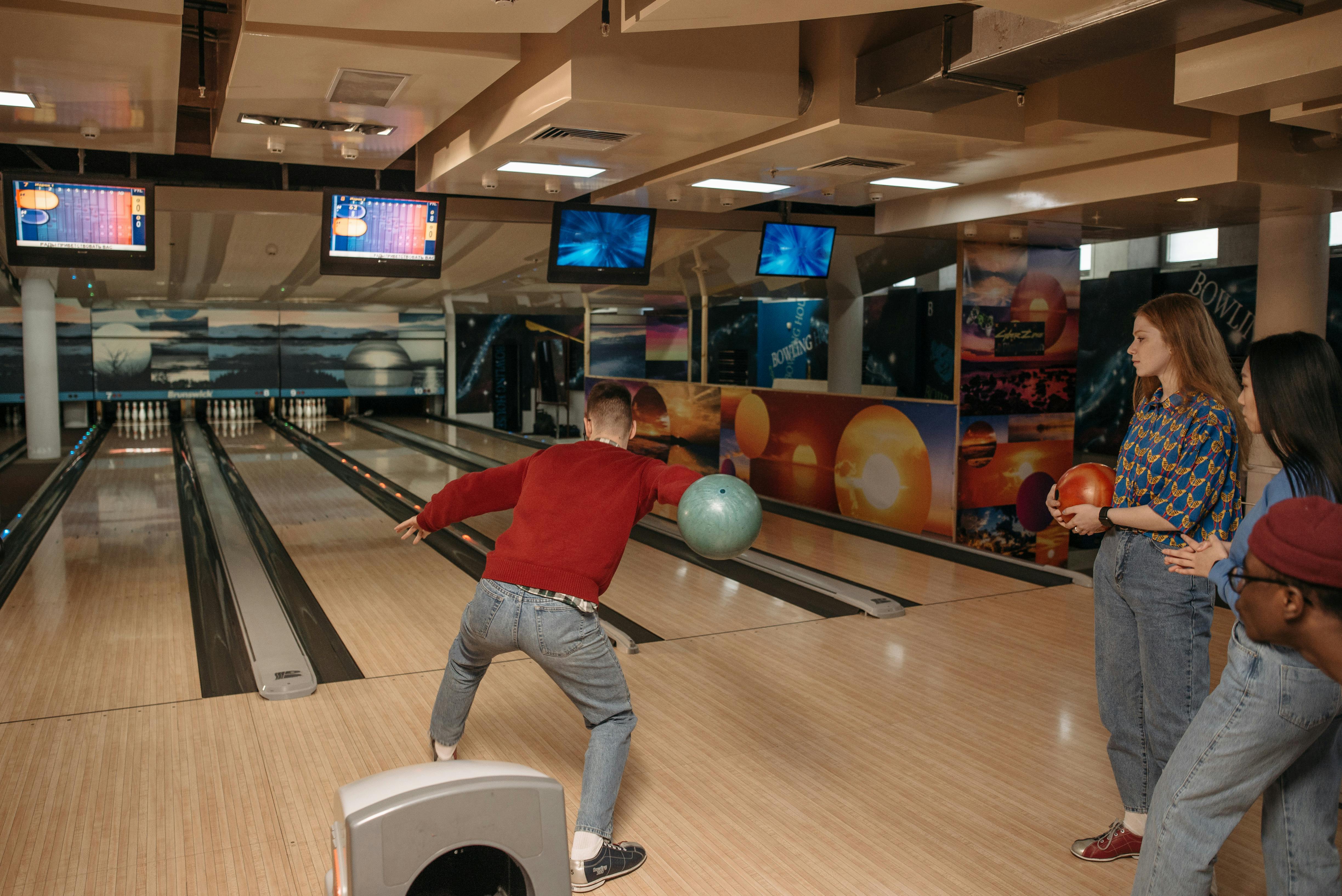Friends Playing Bowling for Recreation · Free Stock Photo