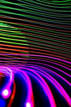 Colorful abstract patterns of light trails creating a dynamic visual effect.