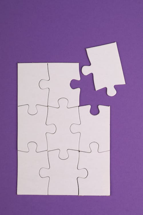 A Jigsaw Puzzle on a Purple Background