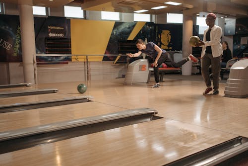 Two People Playing Bowling
