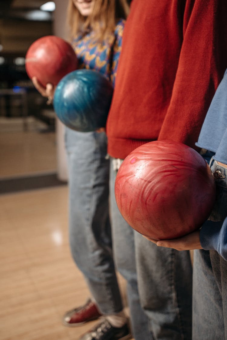 Group Of People Holding Bowling Balls