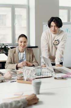 Team members brainstorming and planning in a modern workspace.
