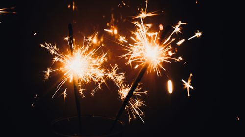 Free A vibrant close-up of sparklers illuminating the dark, perfect for festive occasions. Stock Photo