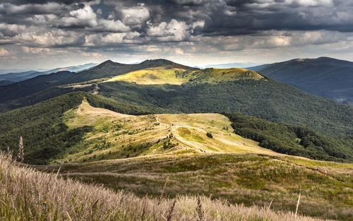 Free Breathtaking view of Bieszczady Mountains under a dramatic sky in Podkarpackie, Poland. Stock Photo