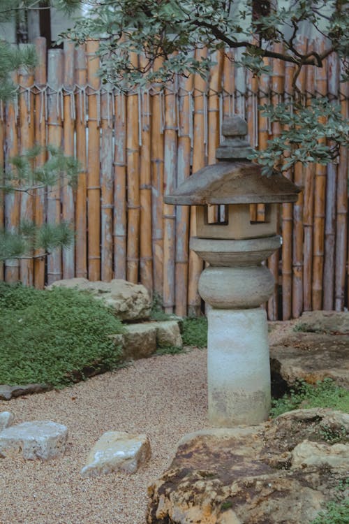 Bamboo Fence Near Green Grass