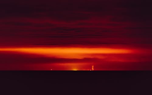 Foto profissional grátis de cênico, céu alaranjado, crepúsculo
