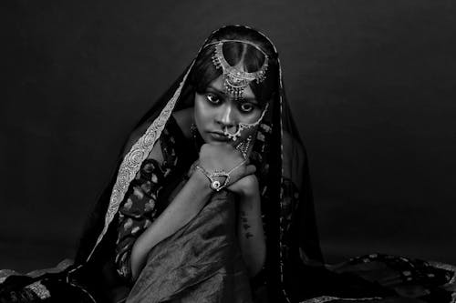 Grayscale Photo of a Woman in Traditional Wear