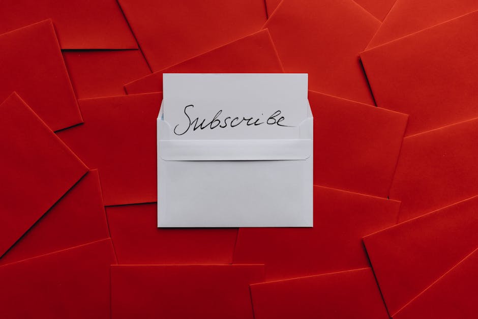 A collection of red envelopes with a central white envelope containing a subscribe card. Perfect for marketing themes