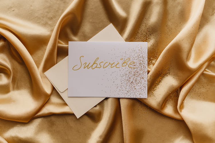 White Card On Gold Textile