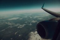Aircraft flying over green land