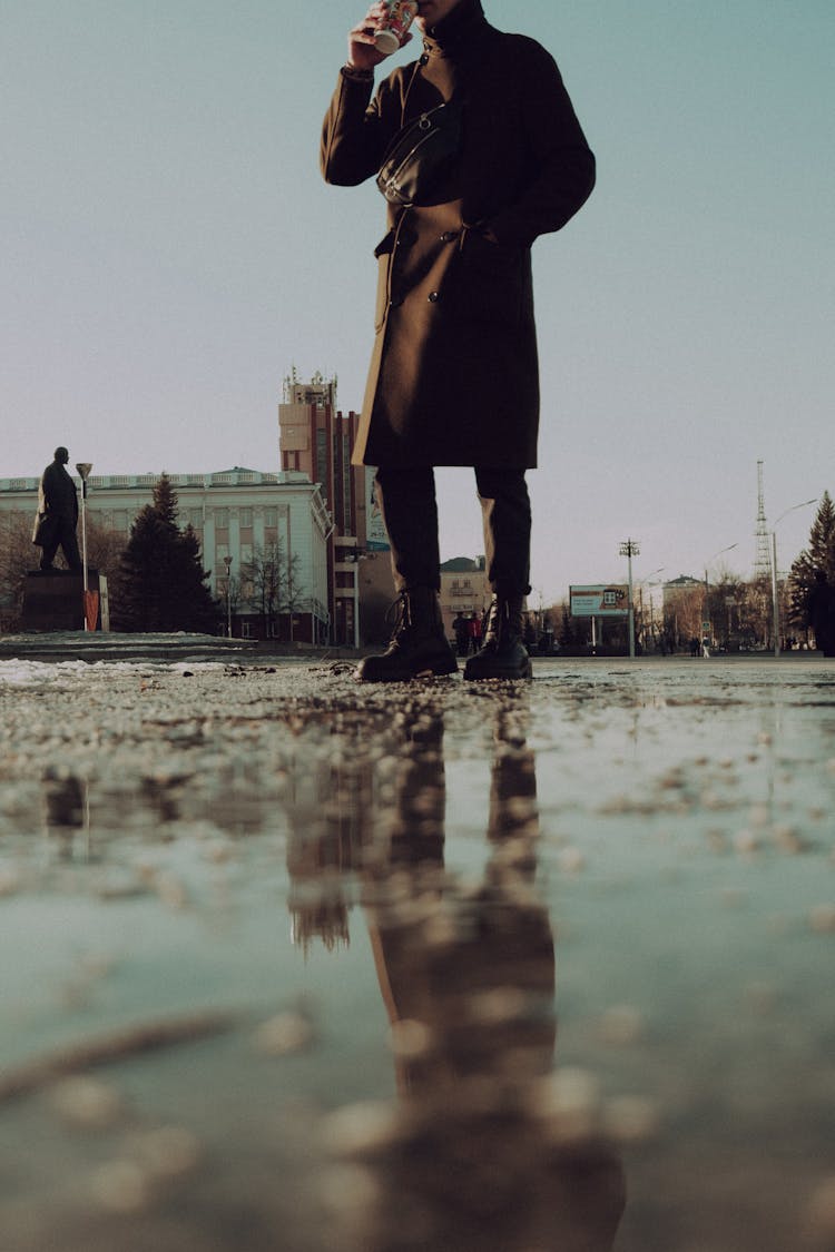 Crop Person Drinking Hot Mug On Street In Autumn