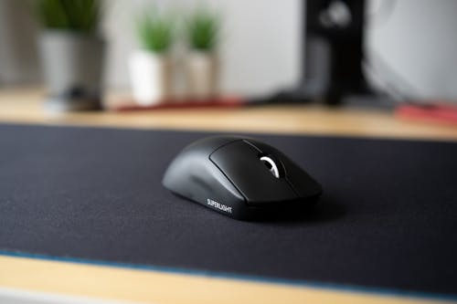 Free Black Computer Mouse on a Pad Stock Photo