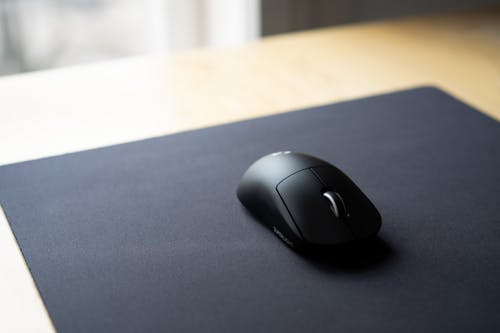 Free A Black Mouse on a Mouse Pad Stock Photo