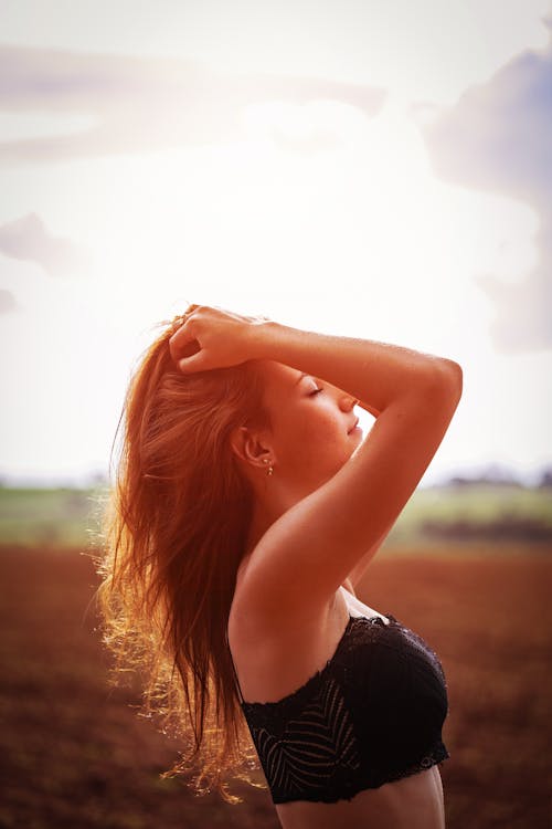 Side View of a Woman Holding her Hair 