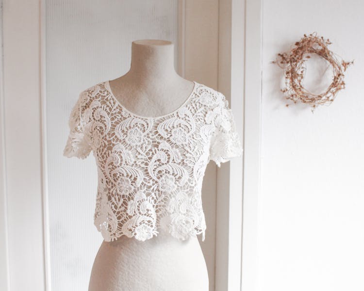 A White Lace Shirt On A Mannequin Body