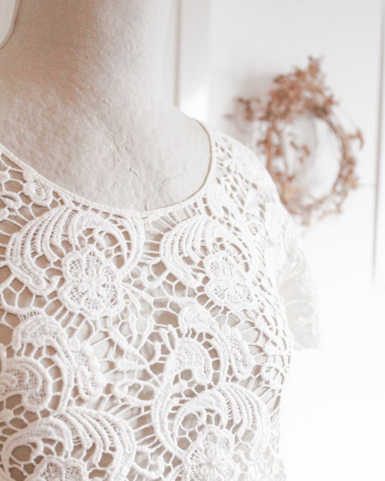 Close-Up Shot Of White Floral Lace Shirt