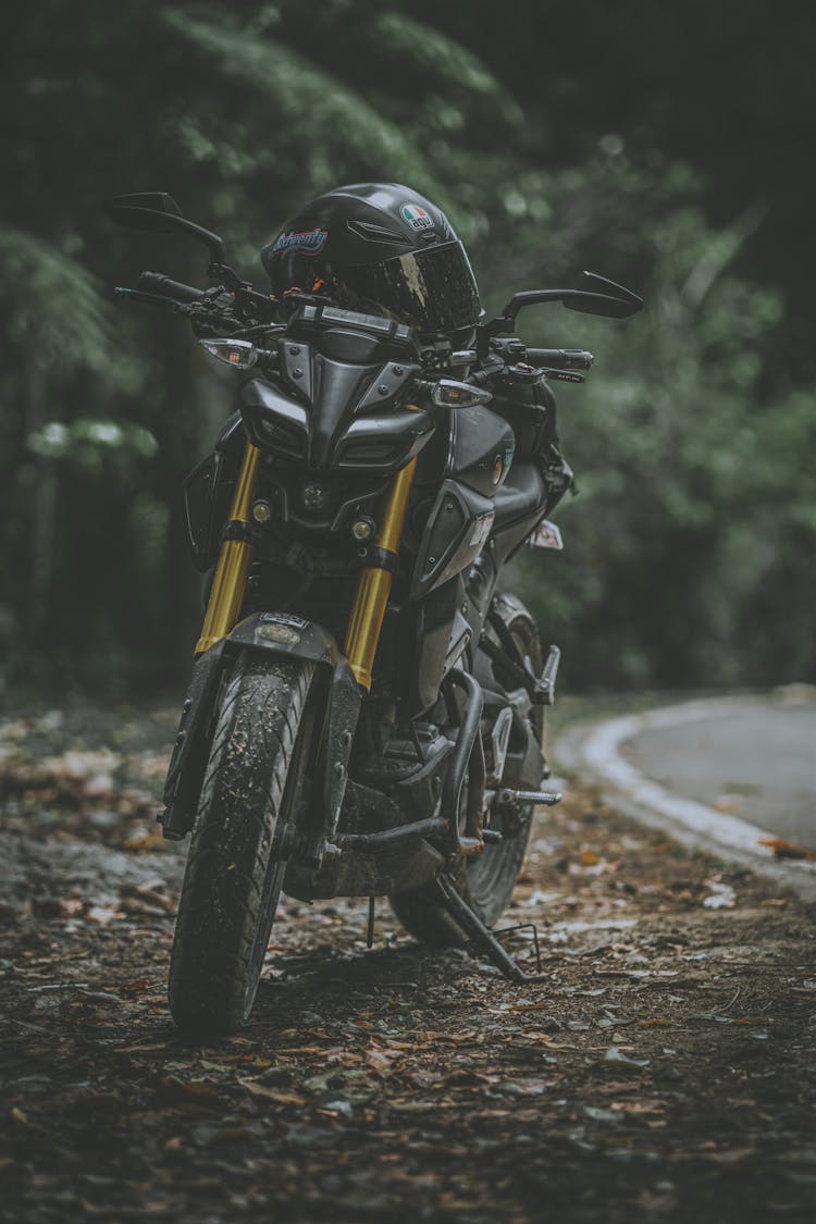 A Motorcycle Parked By The Road