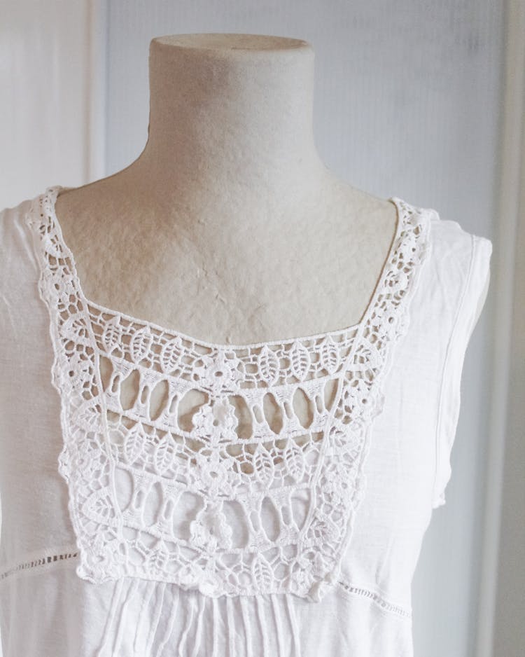 A White Top With Laces On A Mannequin