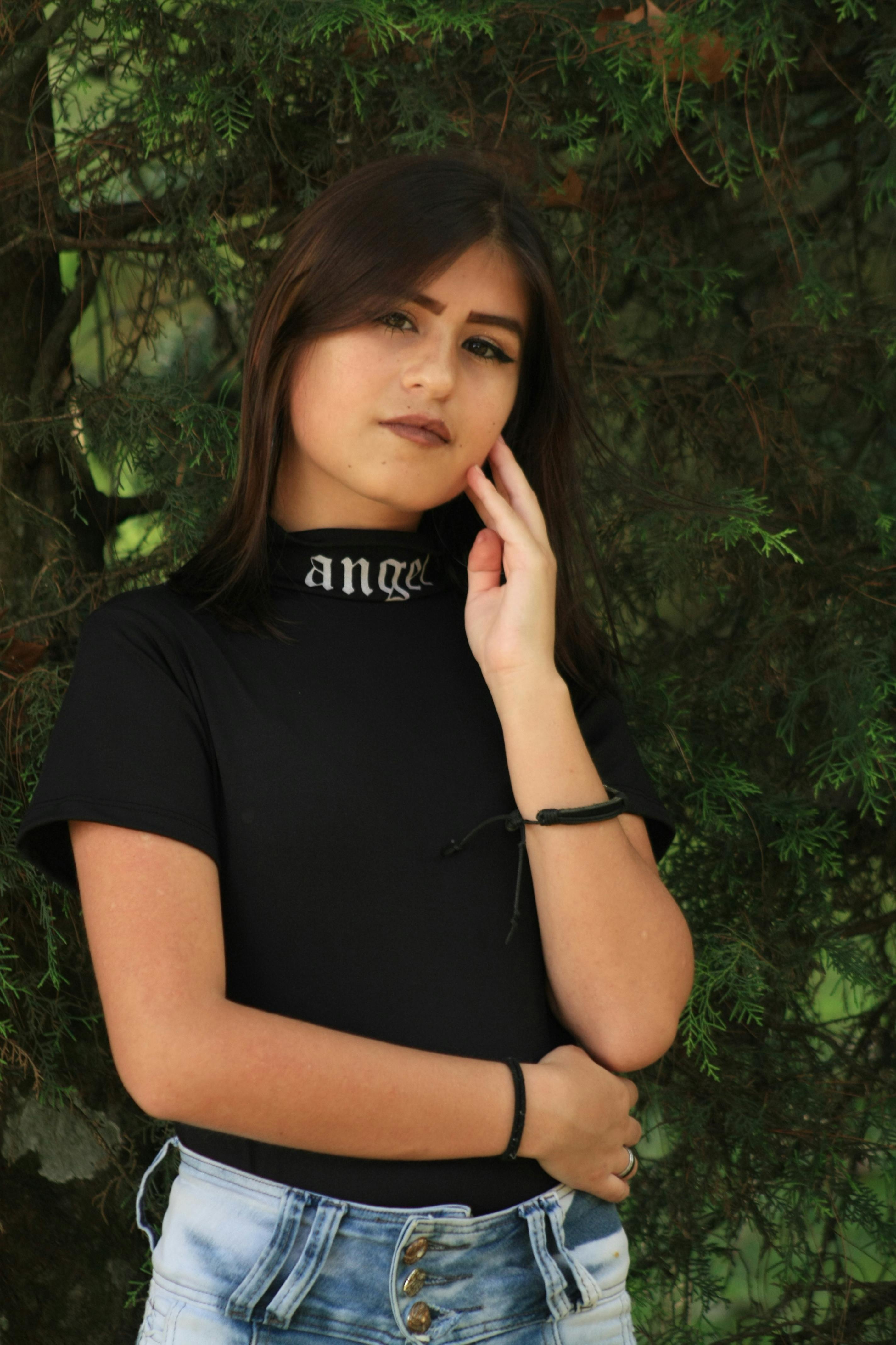 Woman in Black Crop Top and Denim Pants · Free Stock Photo