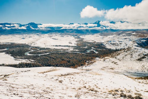 Бесплатное стоковое фото с голубое небо, заснеженные горы, зима