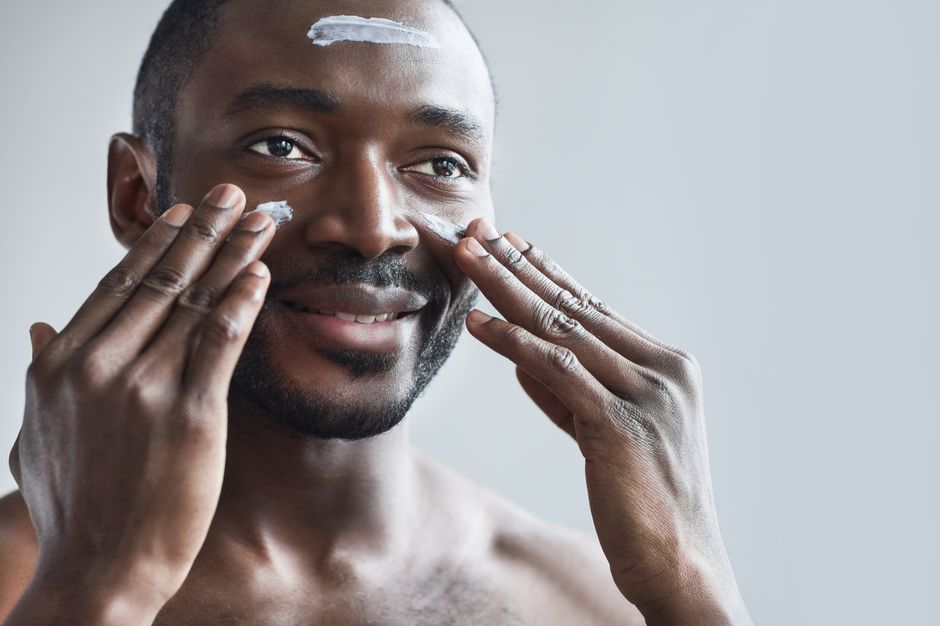 A person with a glowing complexion after applying the right cream for their skin type - face care cream A person with a glowing complexion after applying the right cream for their skin type - face care cream