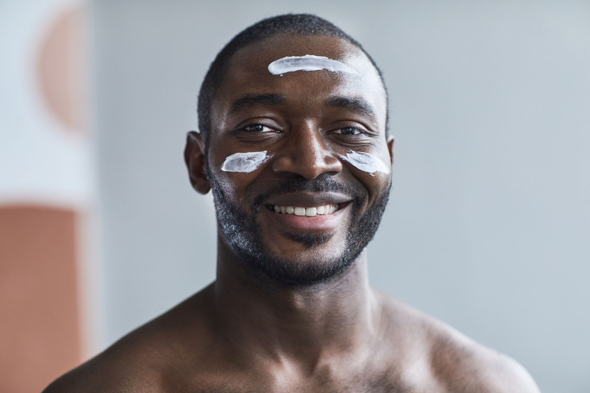 Man with Face Cream on Face Smiling