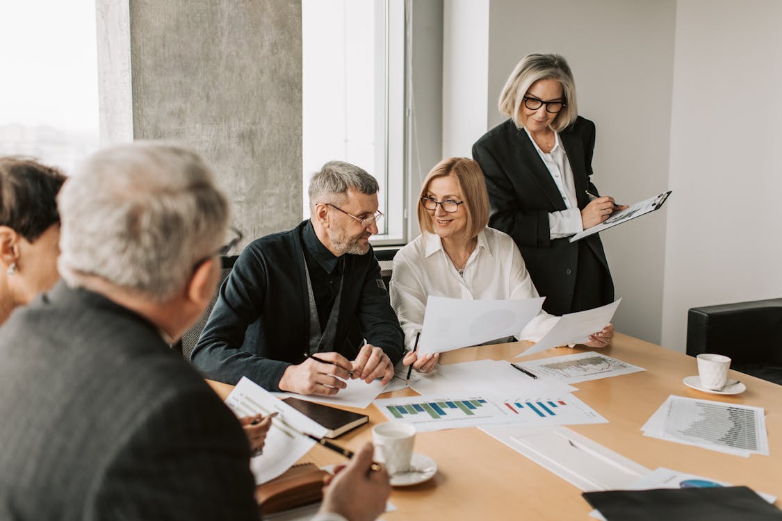 Free Colleagues Looking at Documents Stock Photo