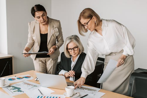 Free Three Women Having a Meeting at the Office Stock Photo