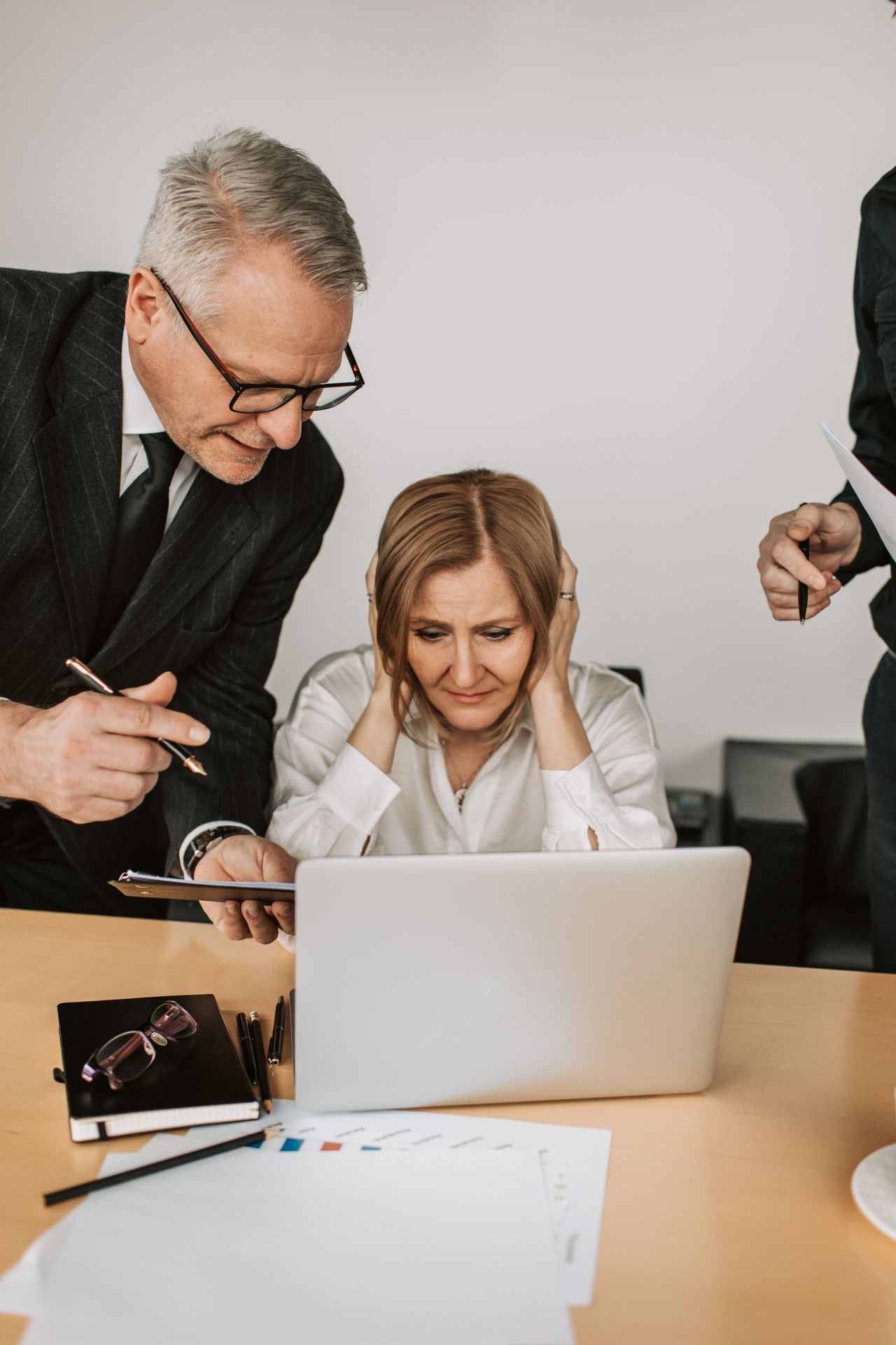 Professional consulting team working through a business strategy discussion in a real office