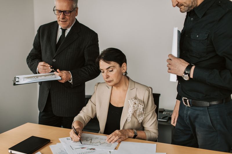 Two people reviewing financial documents together — photo by Vlada Karpovich on Pexels