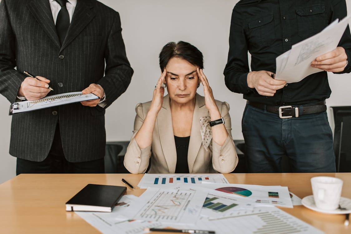 Free Stressed Elderly Woman Holding Her Head Stock Photo