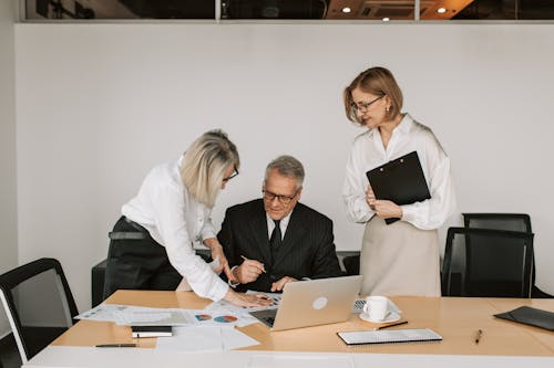 Free Business Partners Having a Meeting at the Office Stock Photo