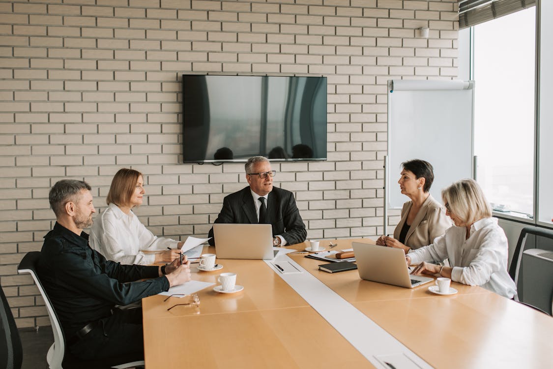 Free 3 Women Sitting at the Table Stock Photo