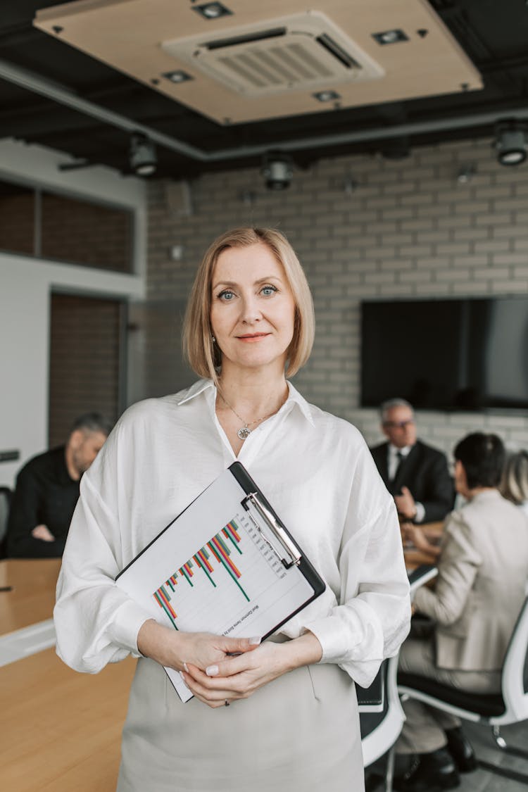 Woman Carrying A Clipboard With Document