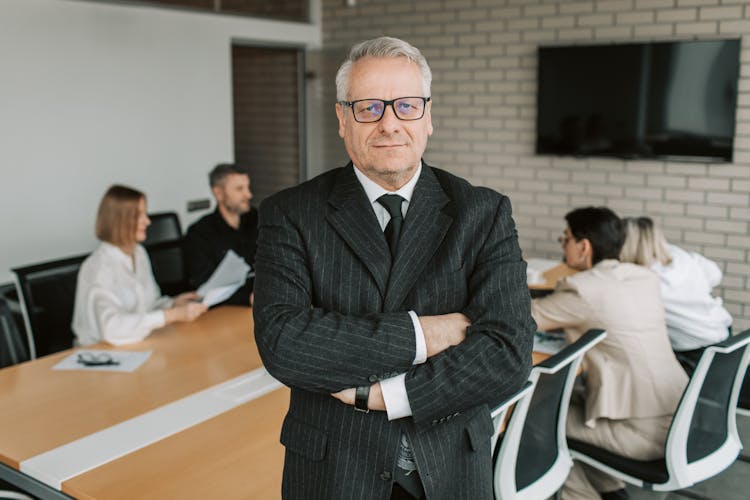 Elderly Man In Black Suit Jacket Standing