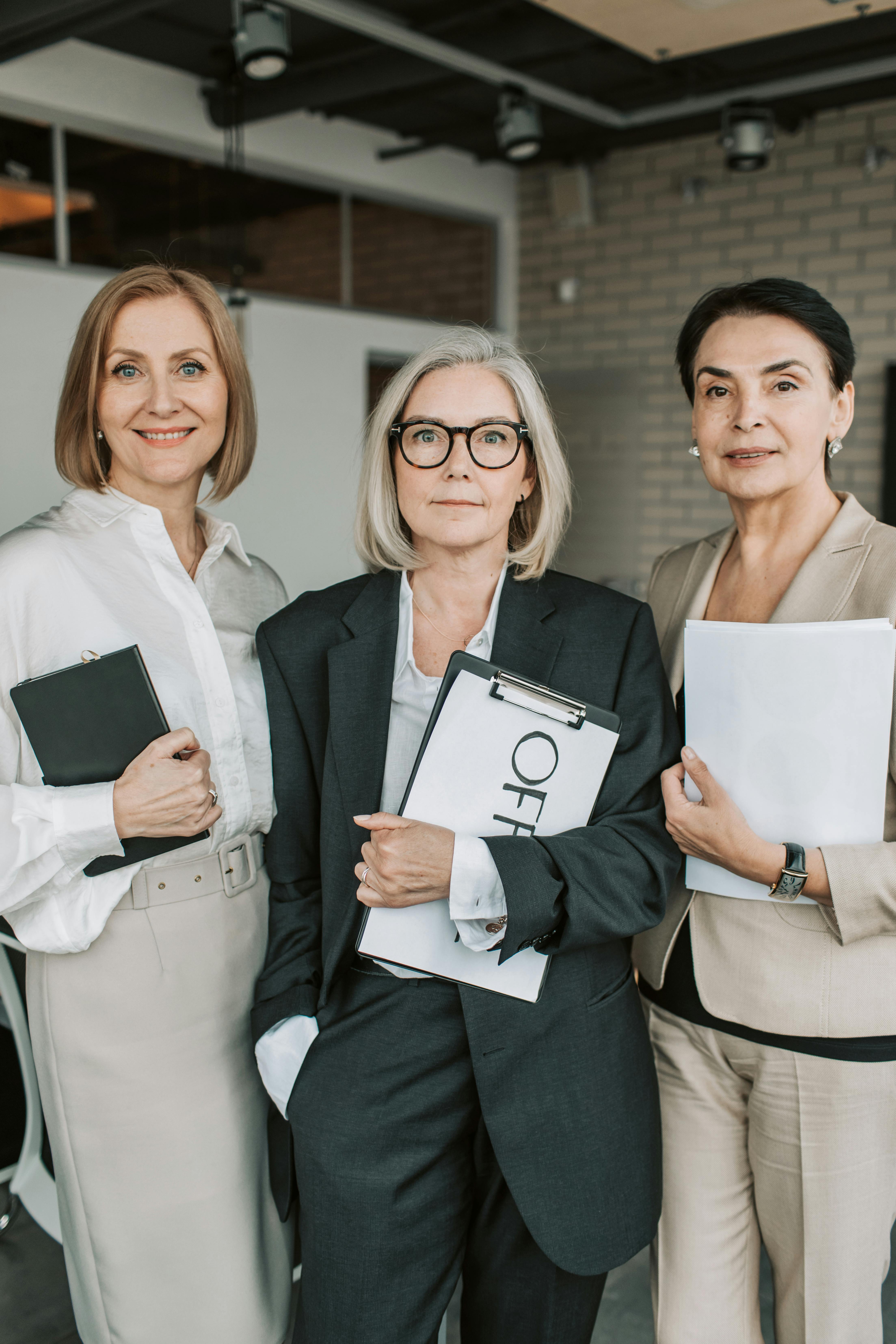 a group of mature women in office attires