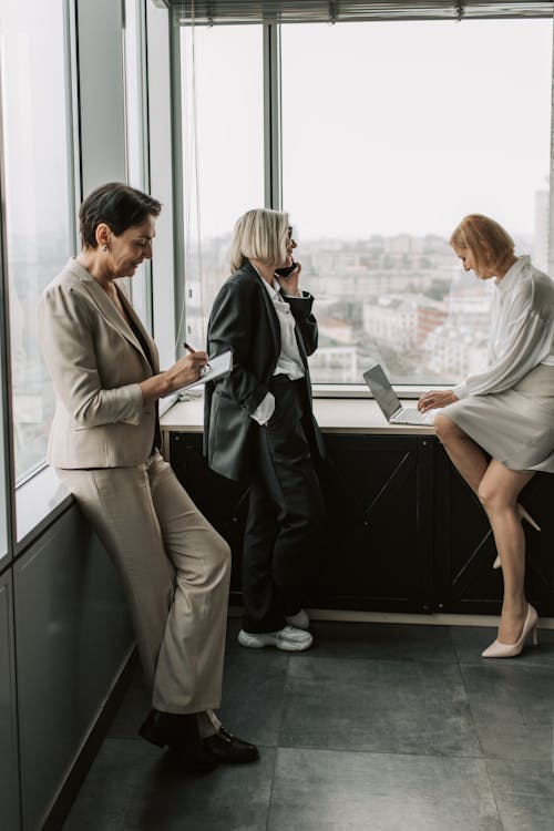 Free Women Busy Working in the Office Stock Photo