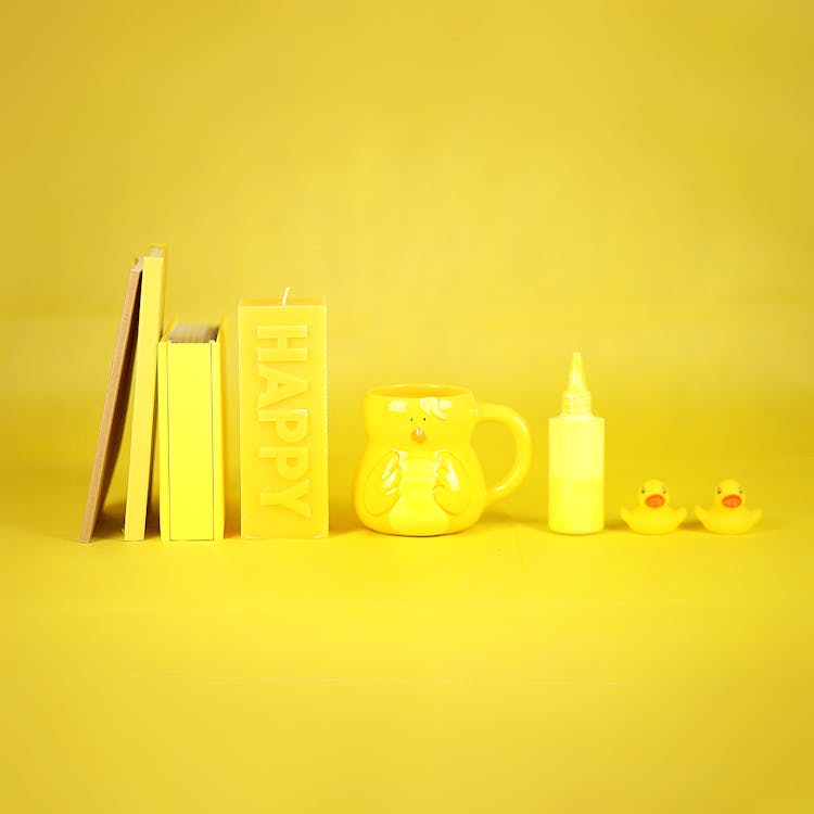 Yellow Mug And Stationery In Row