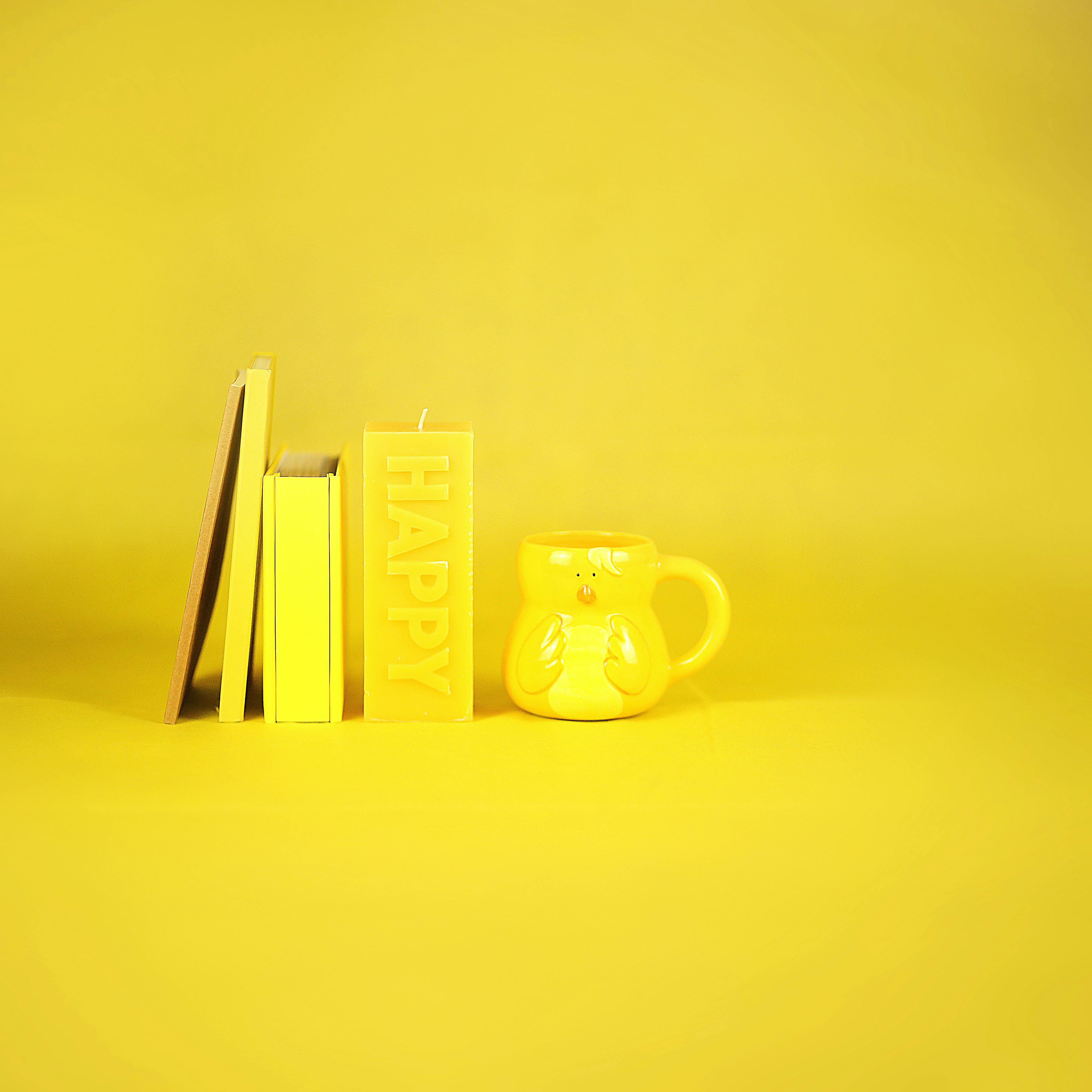 yellow mug and stationery composition