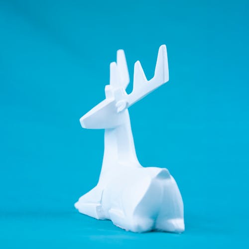 Modern white statuette of deer